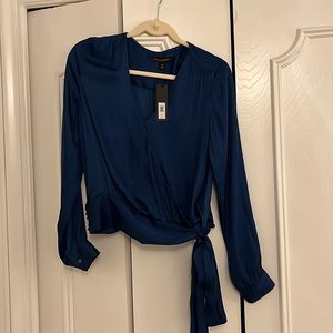 Long sleeve wrap top in peacock color.